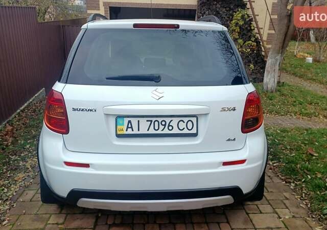Белый Сузуки СХ4, объемом двигателя 1.6 л и пробегом 98 тыс. км за 11000 $, фото 1 на Automoto.ua