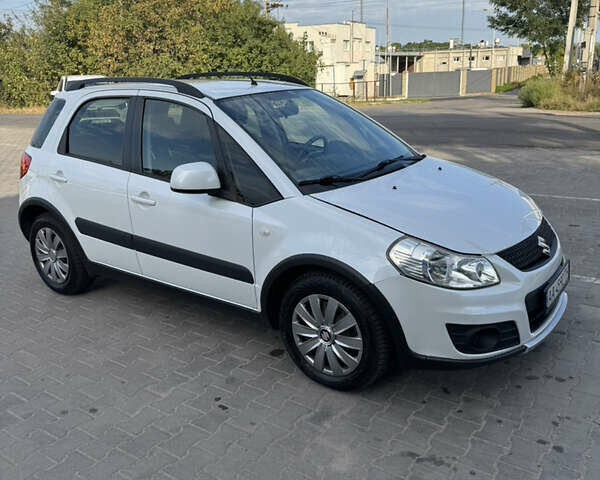 Белый Сузуки СХ4, объемом двигателя 1.59 л и пробегом 134 тыс. км за 9800 $, фото 2 на Automoto.ua