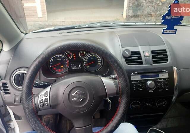 Белый Сузуки СХ4, объемом двигателя 1.6 л и пробегом 98 тыс. км за 11000 $, фото 4 на Automoto.ua