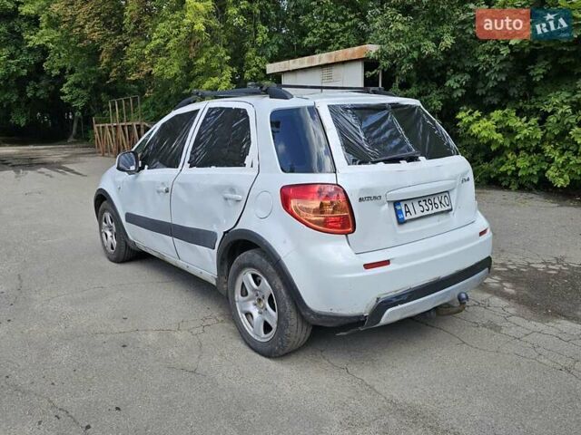 Белый Сузуки СХ4, объемом двигателя 1.59 л и пробегом 100 тыс. км за 3800 $, фото 1 на Automoto.ua