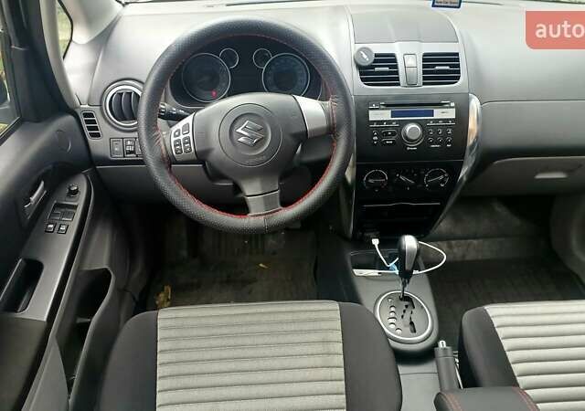 Белый Сузуки СХ4, объемом двигателя 1.6 л и пробегом 98 тыс. км за 11000 $, фото 7 на Automoto.ua