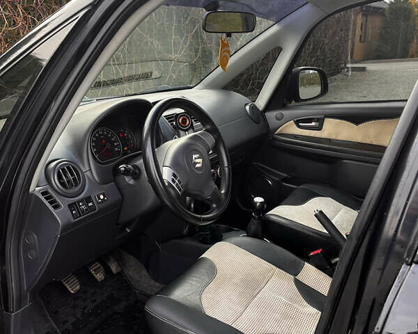 Чорний Сузукі СХ4, об'ємом двигуна 1.6 л та пробігом 315 тис. км за 5000 $, фото 21 на Automoto.ua