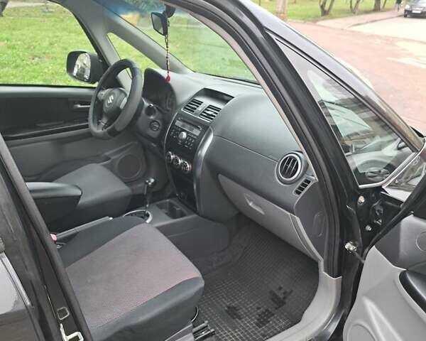 Чорний Сузукі СХ4, об'ємом двигуна 1.59 л та пробігом 265 тис. км за 6500 $, фото 5 на Automoto.ua