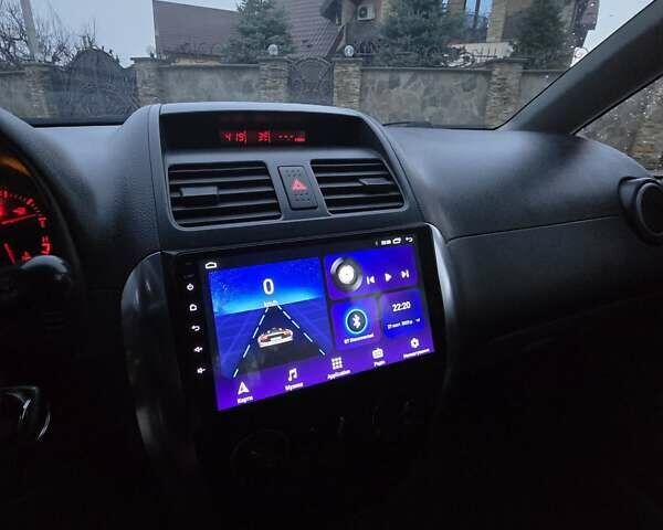 Черный Сузуки СХ4, объемом двигателя 1.6 л и пробегом 178 тыс. км за 5700 $, фото 17 на Automoto.ua