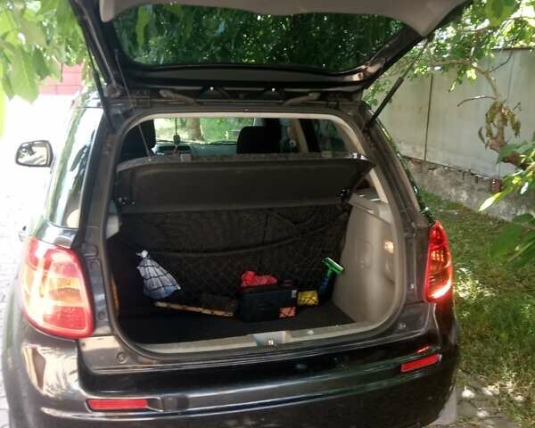 Черный Сузуки СХ4, объемом двигателя 1.6 л и пробегом 120 тыс. км за 6300 $, фото 2 на Automoto.ua