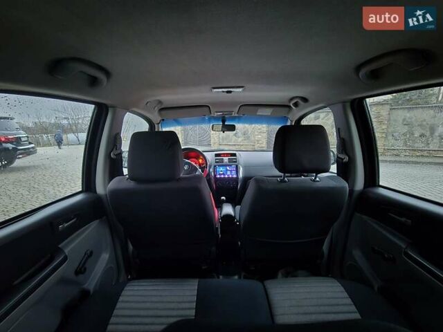 Черный Сузуки СХ4, объемом двигателя 1.6 л и пробегом 178 тыс. км за 5700 $, фото 15 на Automoto.ua