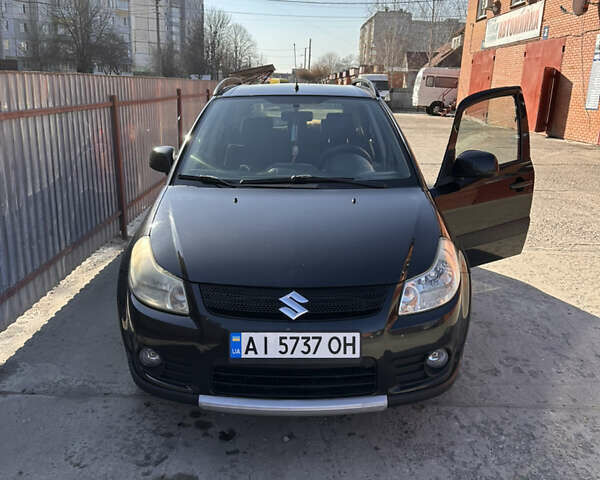 Черный Сузуки СХ4, объемом двигателя 1.6 л и пробегом 131 тыс. км за 7500 $, фото 1 на Automoto.ua