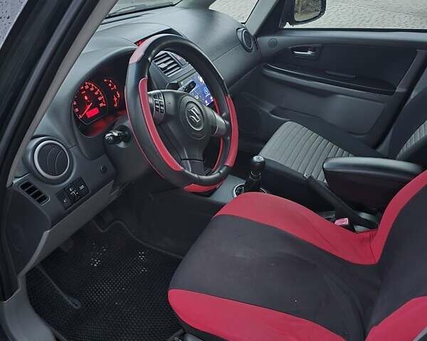 Черный Сузуки СХ4, объемом двигателя 1.6 л и пробегом 178 тыс. км за 5700 $, фото 24 на Automoto.ua