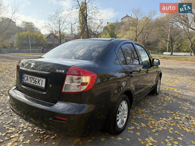 Черный Сузуки СХ4, объемом двигателя 2 л и пробегом 240 тыс. км за 8500 $, фото 2 на Automoto.ua