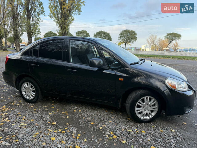 Чорний Сузукі СХ4, об'ємом двигуна 2 л та пробігом 148 тис. км за 7000 $, фото 6 на Automoto.ua