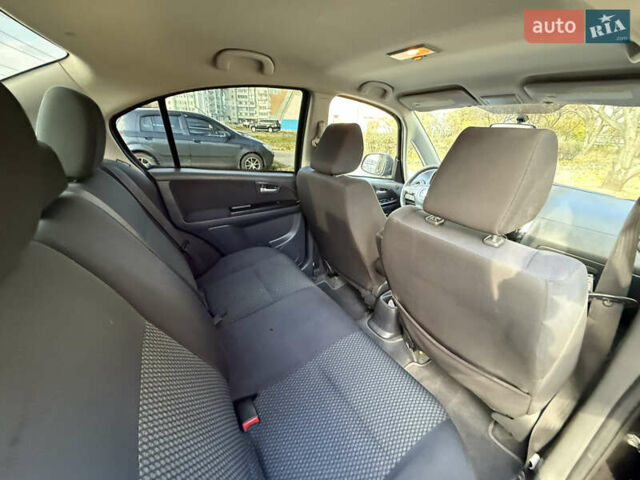 Чорний Сузукі СХ4, об'ємом двигуна 2 л та пробігом 148 тис. км за 7000 $, фото 11 на Automoto.ua