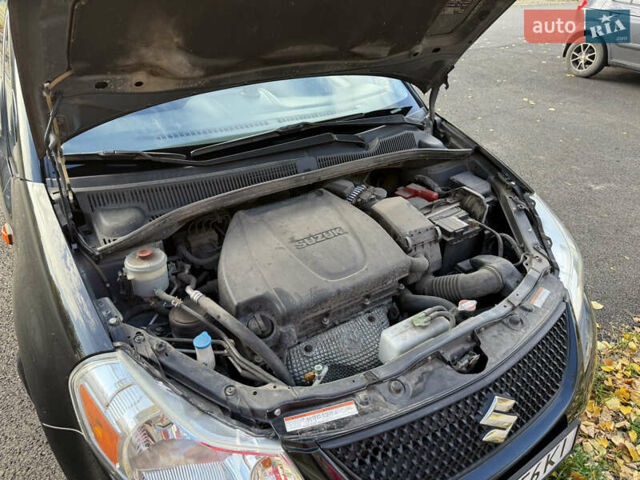 Чорний Сузукі СХ4, об'ємом двигуна 2 л та пробігом 148 тис. км за 7000 $, фото 10 на Automoto.ua