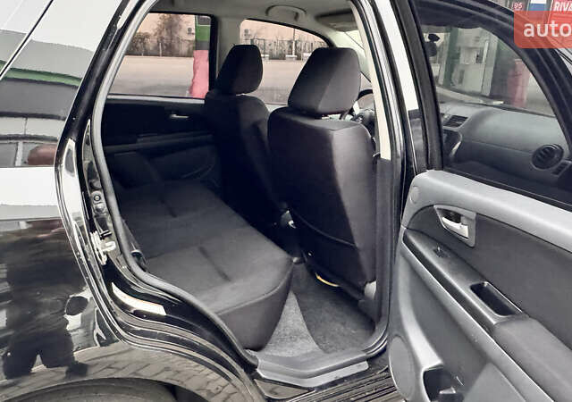 Чорний Сузукі СХ4, об'ємом двигуна 2 л та пробігом 240 тис. км за 6950 $, фото 25 на Automoto.ua
