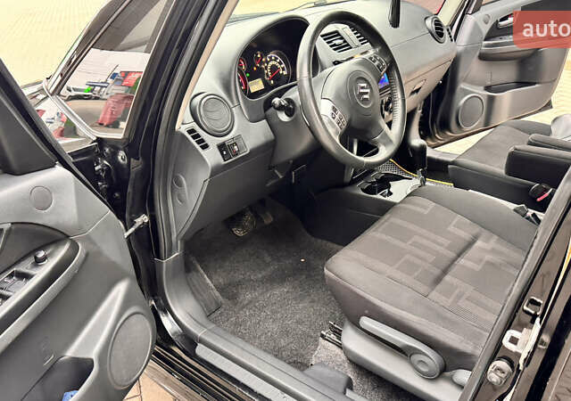 Чорний Сузукі СХ4, об'ємом двигуна 2 л та пробігом 240 тис. км за 6950 $, фото 23 на Automoto.ua