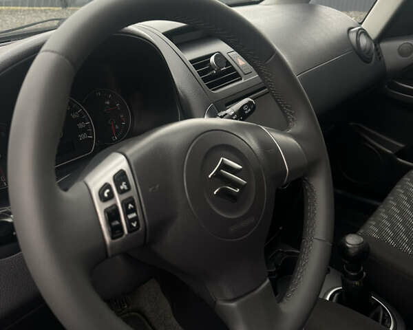 Черный Сузуки СХ4, объемом двигателя 1.6 л и пробегом 195 тыс. км за 7990 $, фото 11 на Automoto.ua