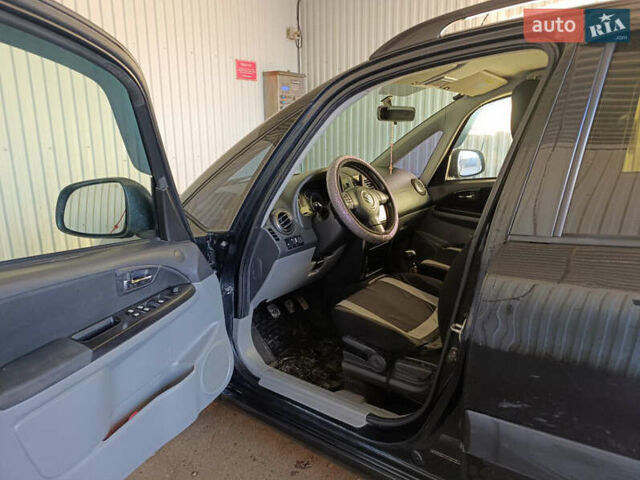 Черный Сузуки СХ4, объемом двигателя 1.6 л и пробегом 248 тыс. км за 8300 $, фото 25 на Automoto.ua