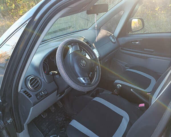 Черный Сузуки СХ4, объемом двигателя 1.6 л и пробегом 248 тыс. км за 8300 $, фото 1 на Automoto.ua