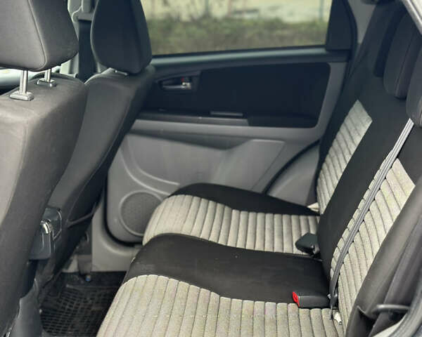 Черный Сузуки СХ4, объемом двигателя 1.59 л и пробегом 211 тыс. км за 7700 $, фото 19 на Automoto.ua