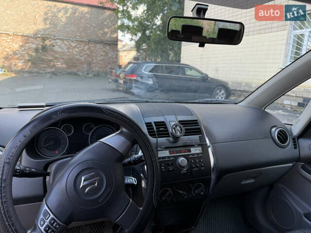 Черный Сузуки СХ4, объемом двигателя 1.6 л и пробегом 235 тыс. км за 9000 $, фото 12 на Automoto.ua