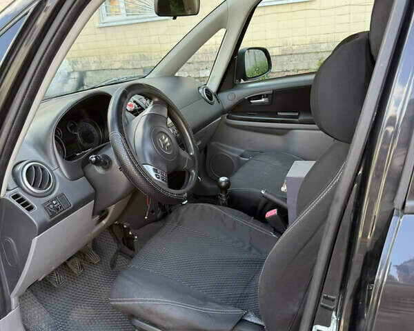 Черный Сузуки СХ4, объемом двигателя 1.6 л и пробегом 235 тыс. км за 9000 $, фото 11 на Automoto.ua