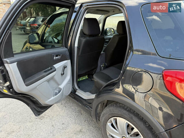 Черный Сузуки СХ4, объемом двигателя 1.6 л и пробегом 235 тыс. км за 9000 $, фото 6 на Automoto.ua