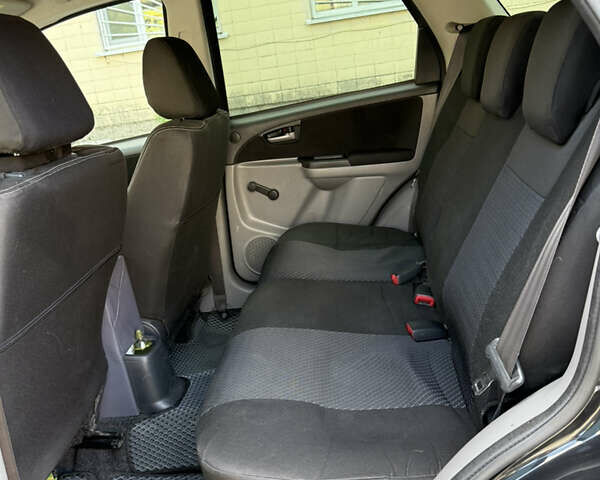 Черный Сузуки СХ4, объемом двигателя 1.6 л и пробегом 235 тыс. км за 9000 $, фото 5 на Automoto.ua