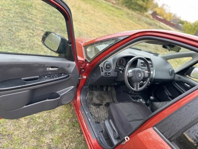 Красный Сузуки СХ4, объемом двигателя 1.6 л и пробегом 235 тыс. км за 3200 $, фото 8 на Automoto.ua