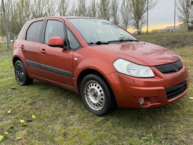 Красный Сузуки СХ4, объемом двигателя 1.6 л и пробегом 235 тыс. км за 3200 $, фото 6 на Automoto.ua