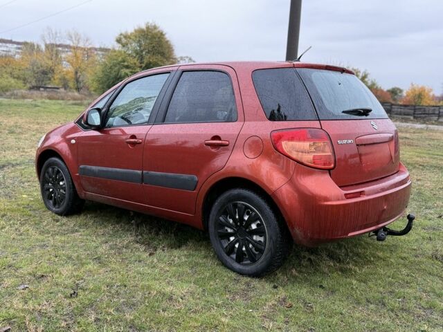 Красный Сузуки СХ4, объемом двигателя 1.6 л и пробегом 235 тыс. км за 3200 $, фото 2 на Automoto.ua