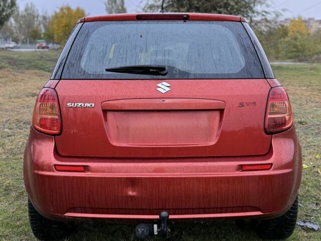 Красный Сузуки СХ4, объемом двигателя 1.6 л и пробегом 235 тыс. км за 3200 $, фото 3 на Automoto.ua