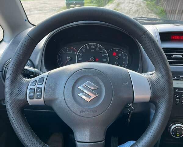 Красный Сузуки СХ4, объемом двигателя 1.6 л и пробегом 233 тыс. км за 5300 $, фото 20 на Automoto.ua