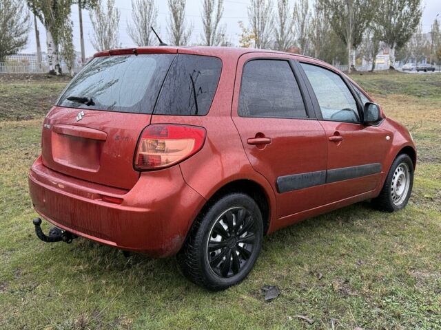 Красный Сузуки СХ4, объемом двигателя 1.6 л и пробегом 235 тыс. км за 3200 $, фото 4 на Automoto.ua