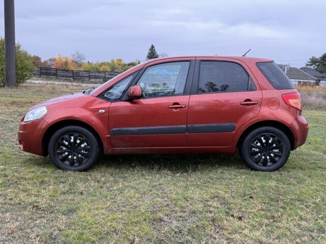 Красный Сузуки СХ4, объемом двигателя 1.6 л и пробегом 235 тыс. км за 3200 $, фото 1 на Automoto.ua