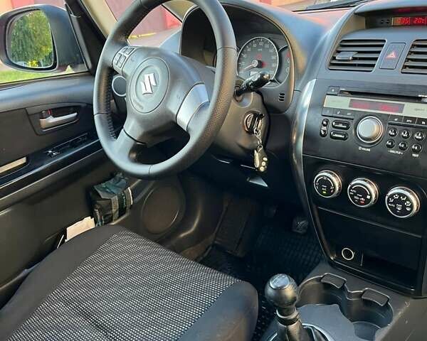 Красный Сузуки СХ4, объемом двигателя 1.6 л и пробегом 233 тыс. км за 5300 $, фото 18 на Automoto.ua