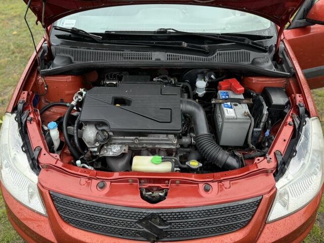 Красный Сузуки СХ4, объемом двигателя 1.6 л и пробегом 235 тыс. км за 3200 $, фото 11 на Automoto.ua