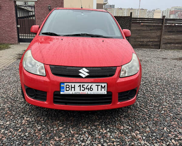 Красный Сузуки СХ4, объемом двигателя 1.59 л и пробегом 183 тыс. км за 6700 $, фото 2 на Automoto.ua