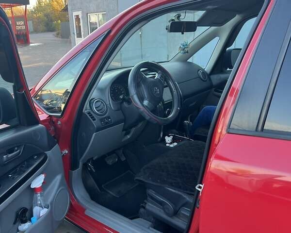 Красный Сузуки СХ4, объемом двигателя 1.6 л и пробегом 200 тыс. км за 7100 $, фото 3 на Automoto.ua