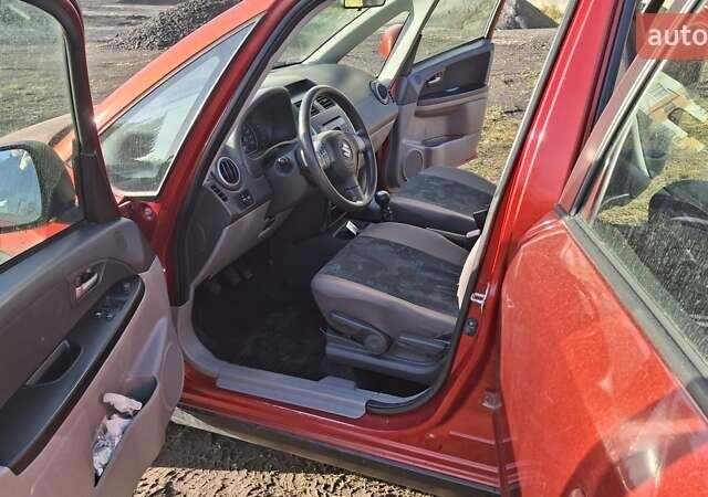 Красный Сузуки СХ4, объемом двигателя 1.5 л и пробегом 123 тыс. км за 4300 $, фото 8 на Automoto.ua