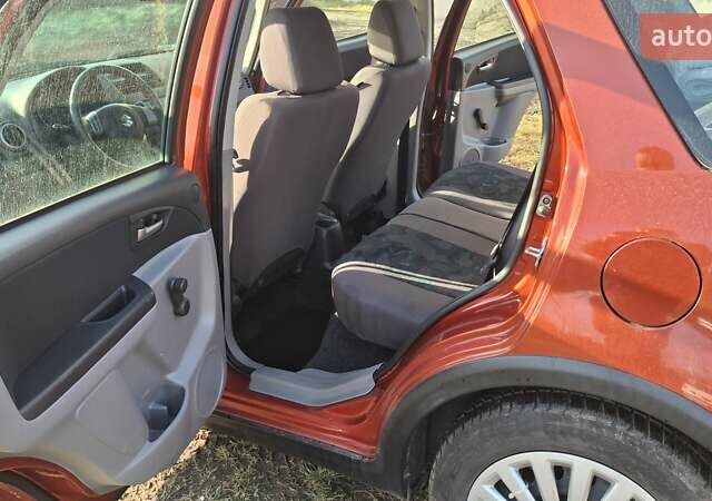 Красный Сузуки СХ4, объемом двигателя 1.5 л и пробегом 123 тыс. км за 4300 $, фото 7 на Automoto.ua