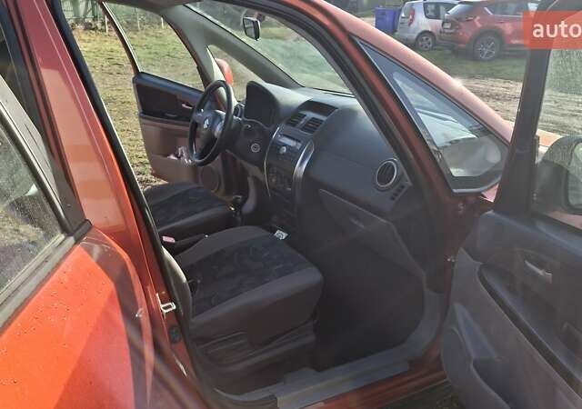 Красный Сузуки СХ4, объемом двигателя 1.5 л и пробегом 123 тыс. км за 4300 $, фото 4 на Automoto.ua