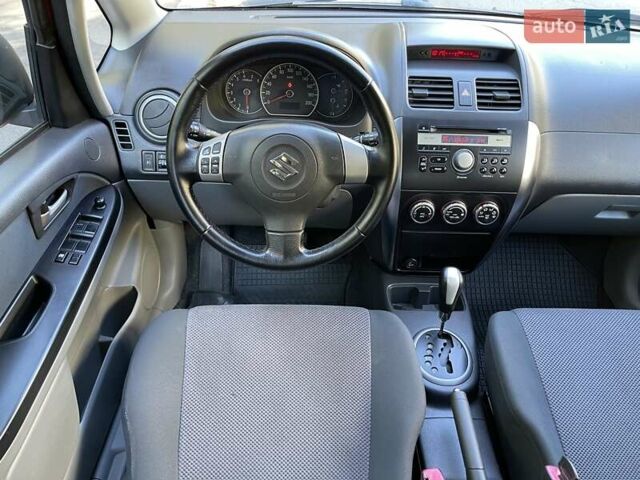 Красный Сузуки СХ4, объемом двигателя 1.6 л и пробегом 145 тыс. км за 7500 $, фото 16 на Automoto.ua