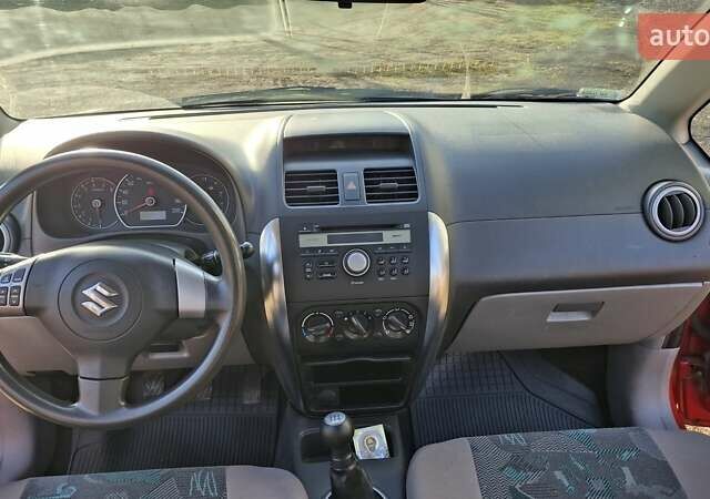 Красный Сузуки СХ4, объемом двигателя 1.5 л и пробегом 123 тыс. км за 4300 $, фото 9 на Automoto.ua