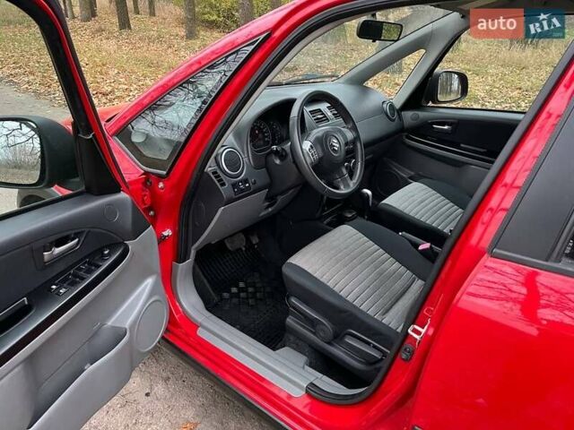 Красный Сузуки СХ4, объемом двигателя 1.6 л и пробегом 101 тыс. км за 7700 $, фото 6 на Automoto.ua