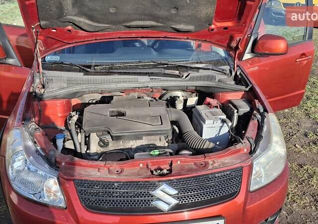 Красный Сузуки СХ4, объемом двигателя 1.5 л и пробегом 123 тыс. км за 4300 $, фото 10 на Automoto.ua