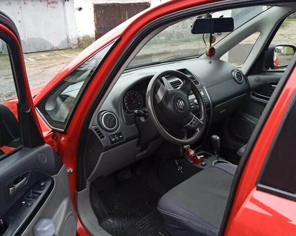 Красный Сузуки СХ4, объемом двигателя 1.6 л и пробегом 161 тыс. км за 6399 $, фото 2 на Automoto.ua