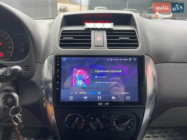 Красный Сузуки СХ4, объемом двигателя 1.59 л и пробегом 191 тыс. км за 5999 $, фото 15 на Automoto.ua