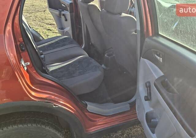 Красный Сузуки СХ4, объемом двигателя 1.5 л и пробегом 123 тыс. км за 4300 $, фото 5 на Automoto.ua