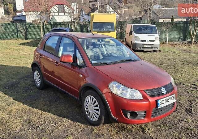 Красный Сузуки СХ4, объемом двигателя 1.5 л и пробегом 123 тыс. км за 4300 $, фото 1 на Automoto.ua