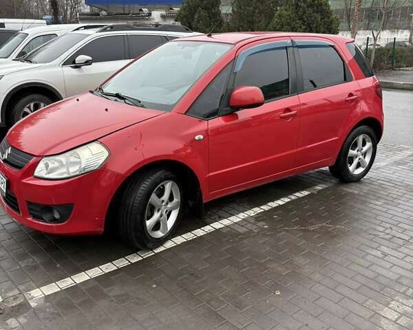 Красный Сузуки СХ4, объемом двигателя 1.59 л и пробегом 200 тыс. км за 5500 $, фото 1 на Automoto.ua