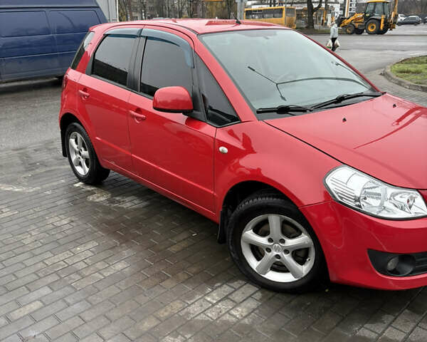 Красный Сузуки СХ4, объемом двигателя 1.59 л и пробегом 200 тыс. км за 5500 $, фото 2 на Automoto.ua